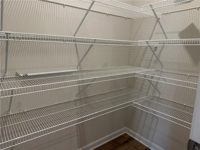 a view of a room with racks on the wall