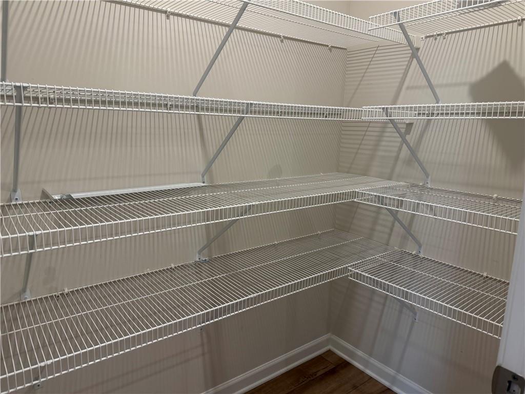 3772 Dover Run Lane Loganville, GA 30052 - Photo 11 of 36 a view of a room with racks on the wall