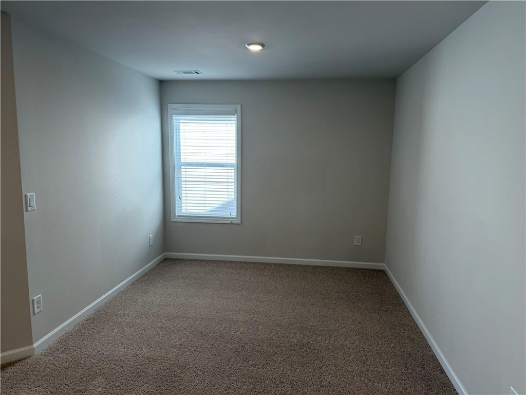 3772 Dover Run Lane Loganville, GA 30052 - Photo 16 of 36 an empty room with a window