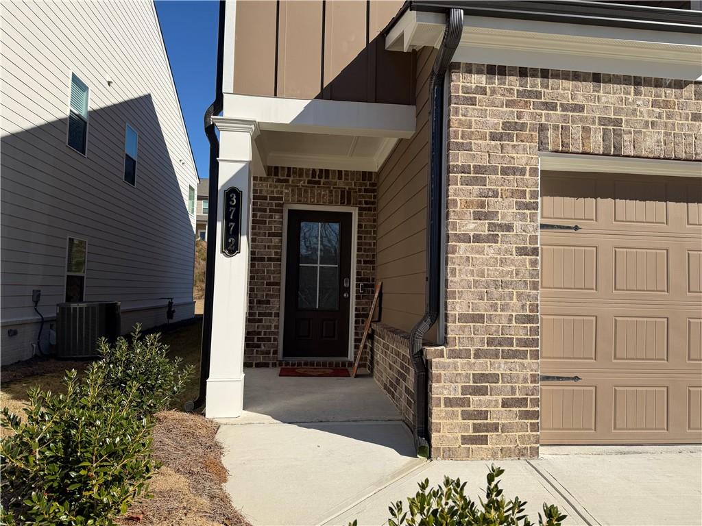 3772 Dover Run Lane Loganville, GA 30052 - Photo 2 of 36 a front view of a house with a garden