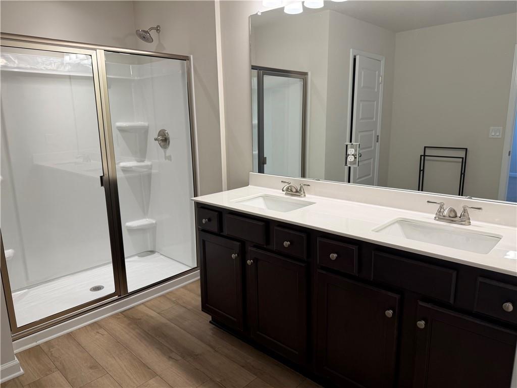 3772 Dover Run Lane Loganville, GA 30052 - Photo 23 of 36 a bathroom with a double vanity sink and mirror