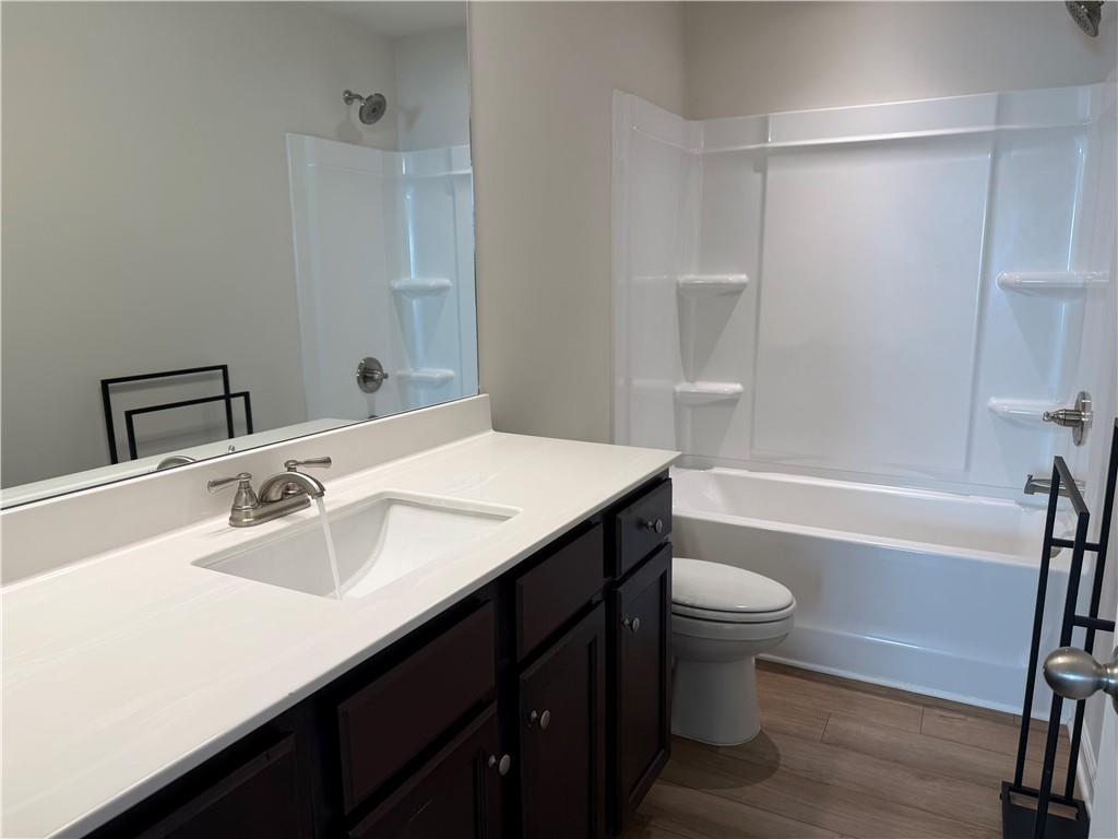 3772 Dover Run Lane Loganville, GA 30052 - Photo 24 of 36 a bathroom with a sink a toilet and shower