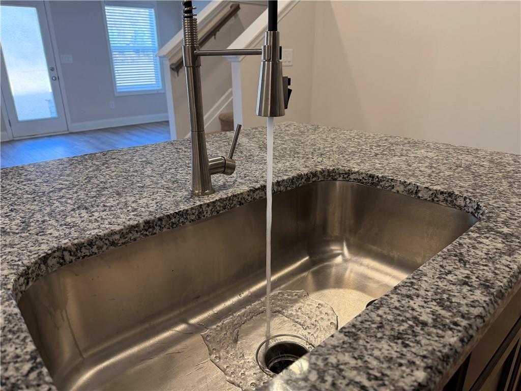 3772 Dover Run Lane Loganville, GA 30052 - Photo 8 of 36 a bathroom with a granite countertop sink and a mirror