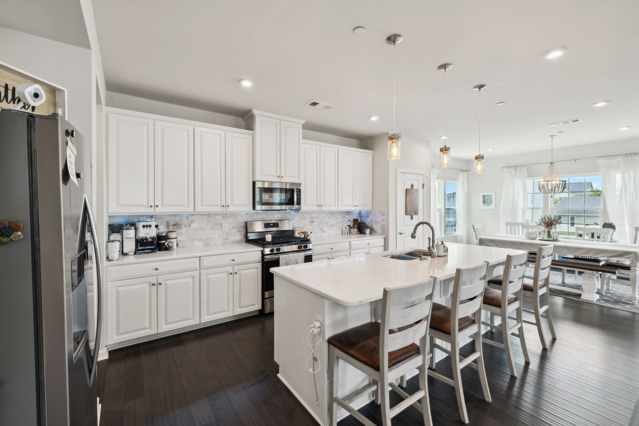 2030 Oglethorpe Drive Franklin, TN 37064 - Photo 19 of 54 a large kitchen with kitchen island granite countertop lots of white cabinets appliances and furniture