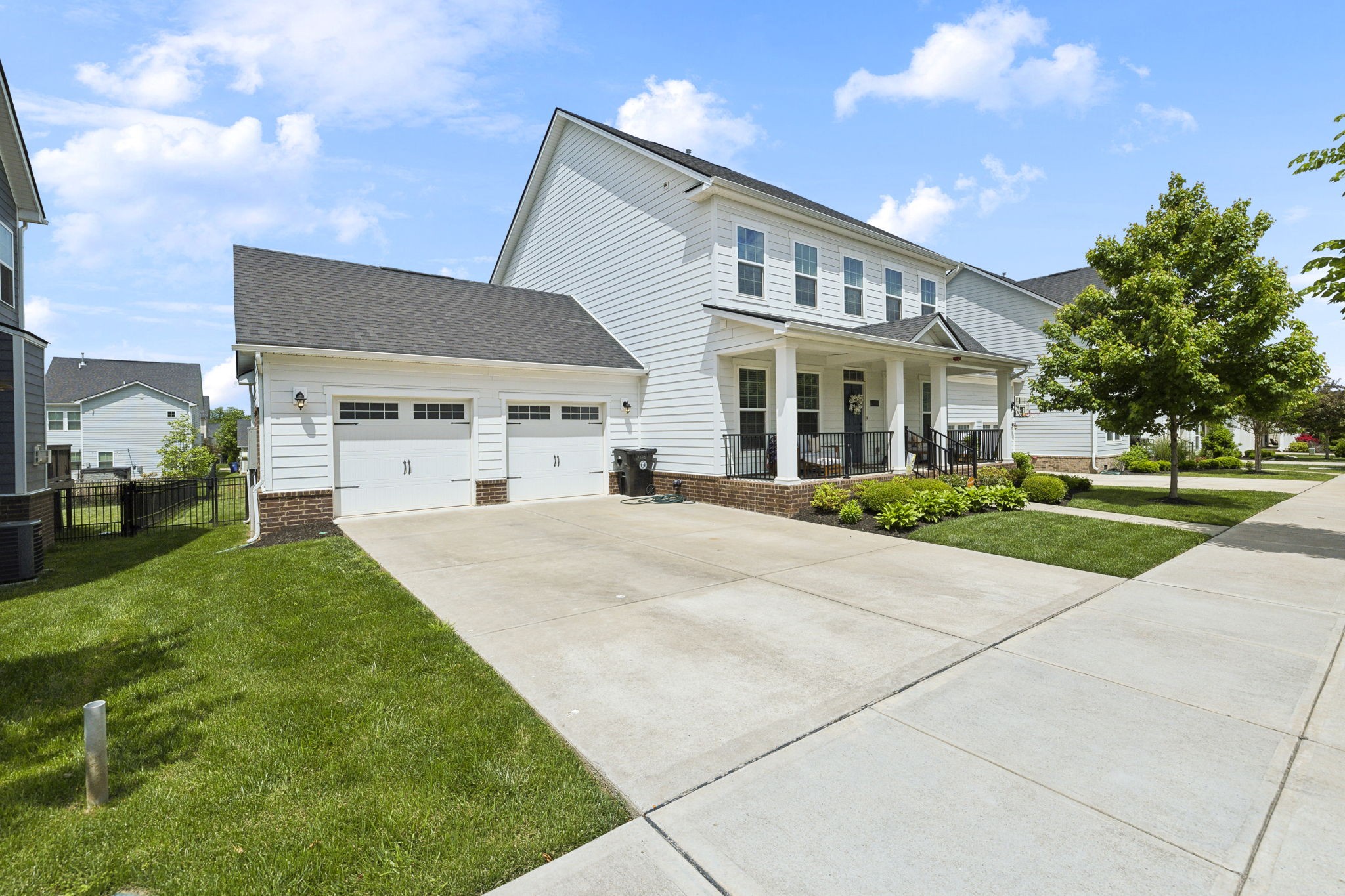 2030 Oglethorpe Drive Franklin, TN 37064 - Photo 2 of 54 a front view of a house with a yard and garage