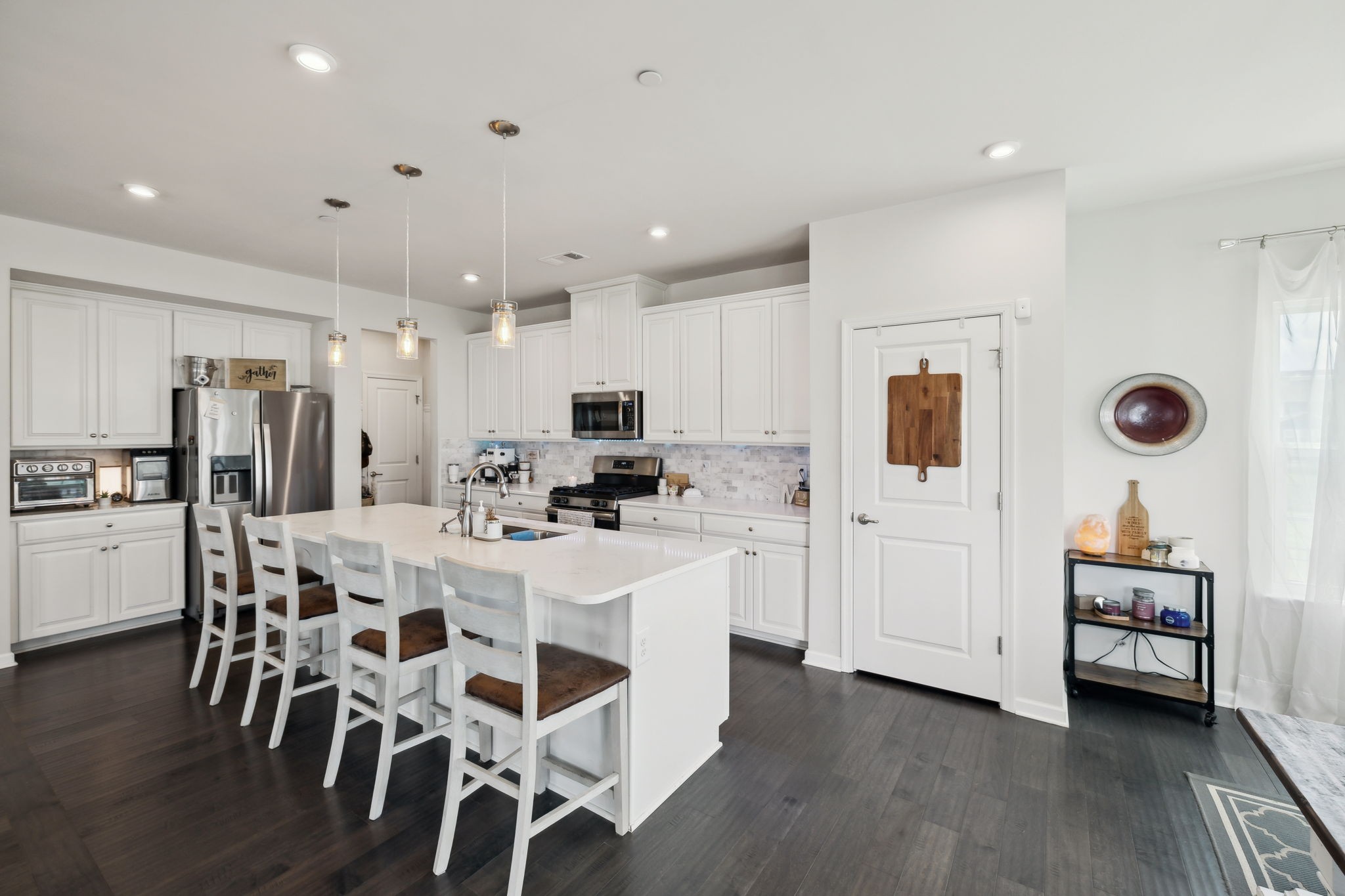 2030 Oglethorpe Drive Franklin, TN 37064 - Photo 21 of 54 a kitchen with white cabinets and stainless steel appliances