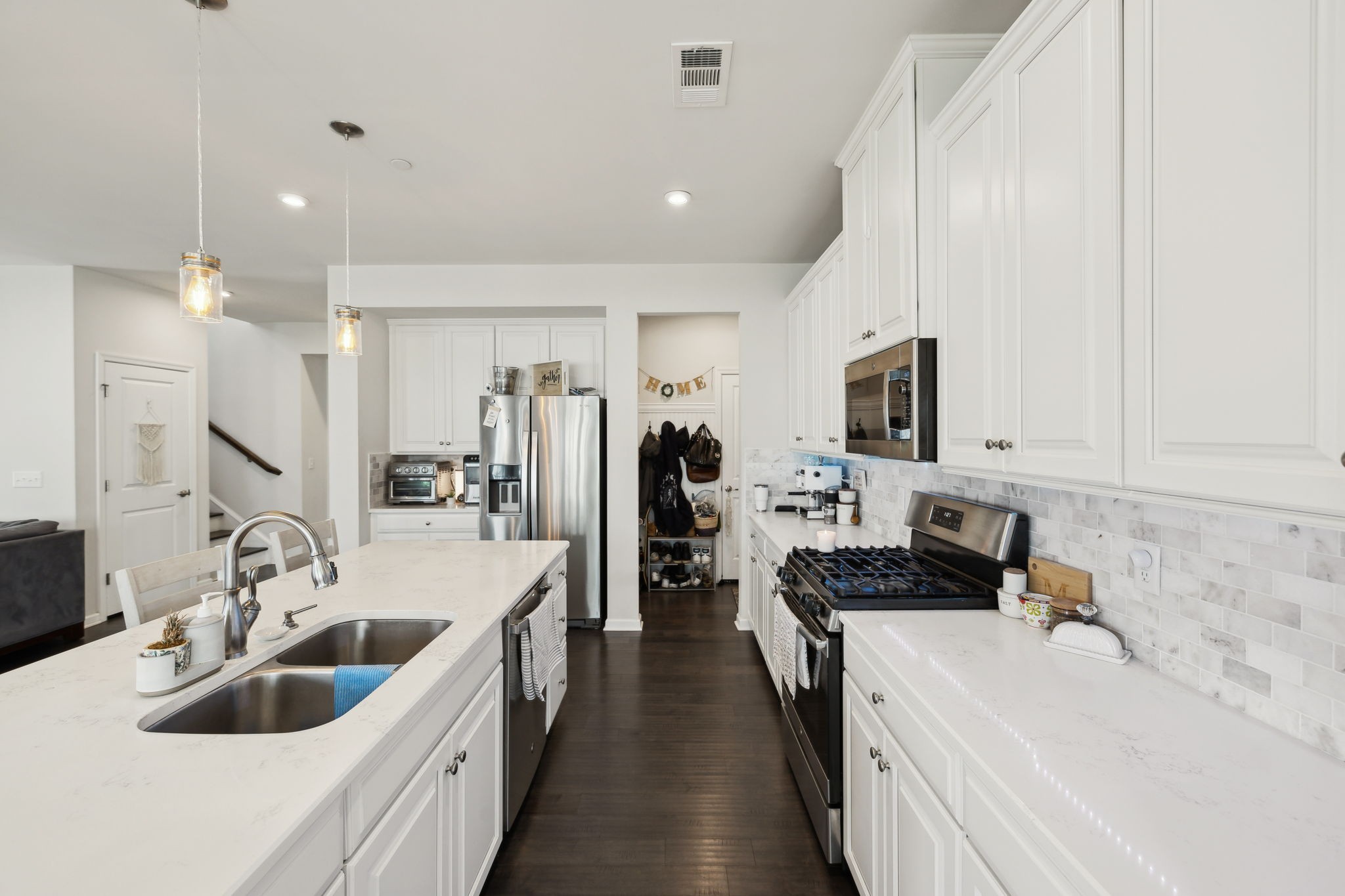 2030 Oglethorpe Drive Franklin, TN 37064 - Photo 22 of 54 a kitchen with a sink stove top oven and refrigerator
