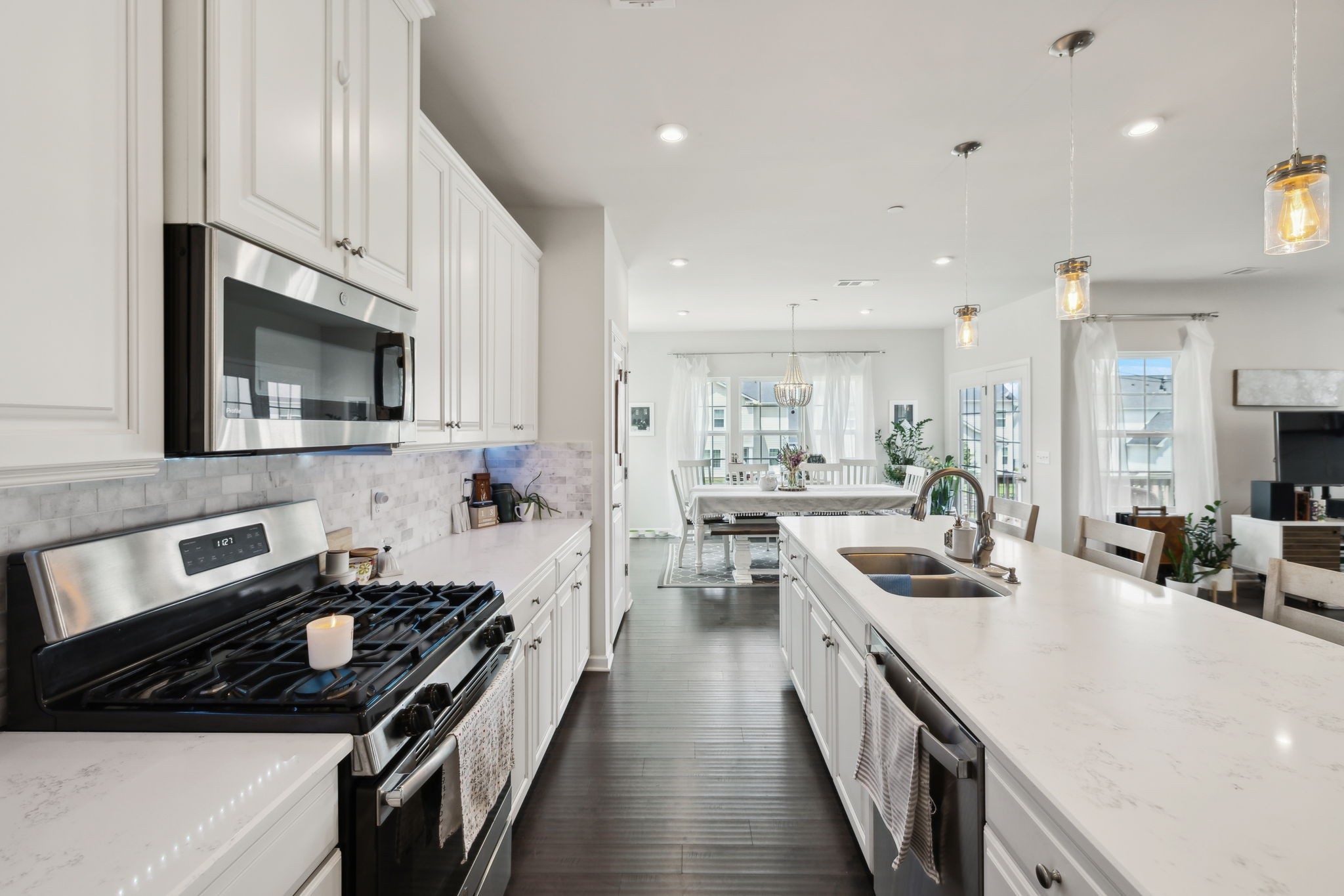 2030 Oglethorpe Drive Franklin, TN 37064 - Photo 23 of 54 a kitchen with stainless steel appliances a sink a stove top oven a counter space and cabinets