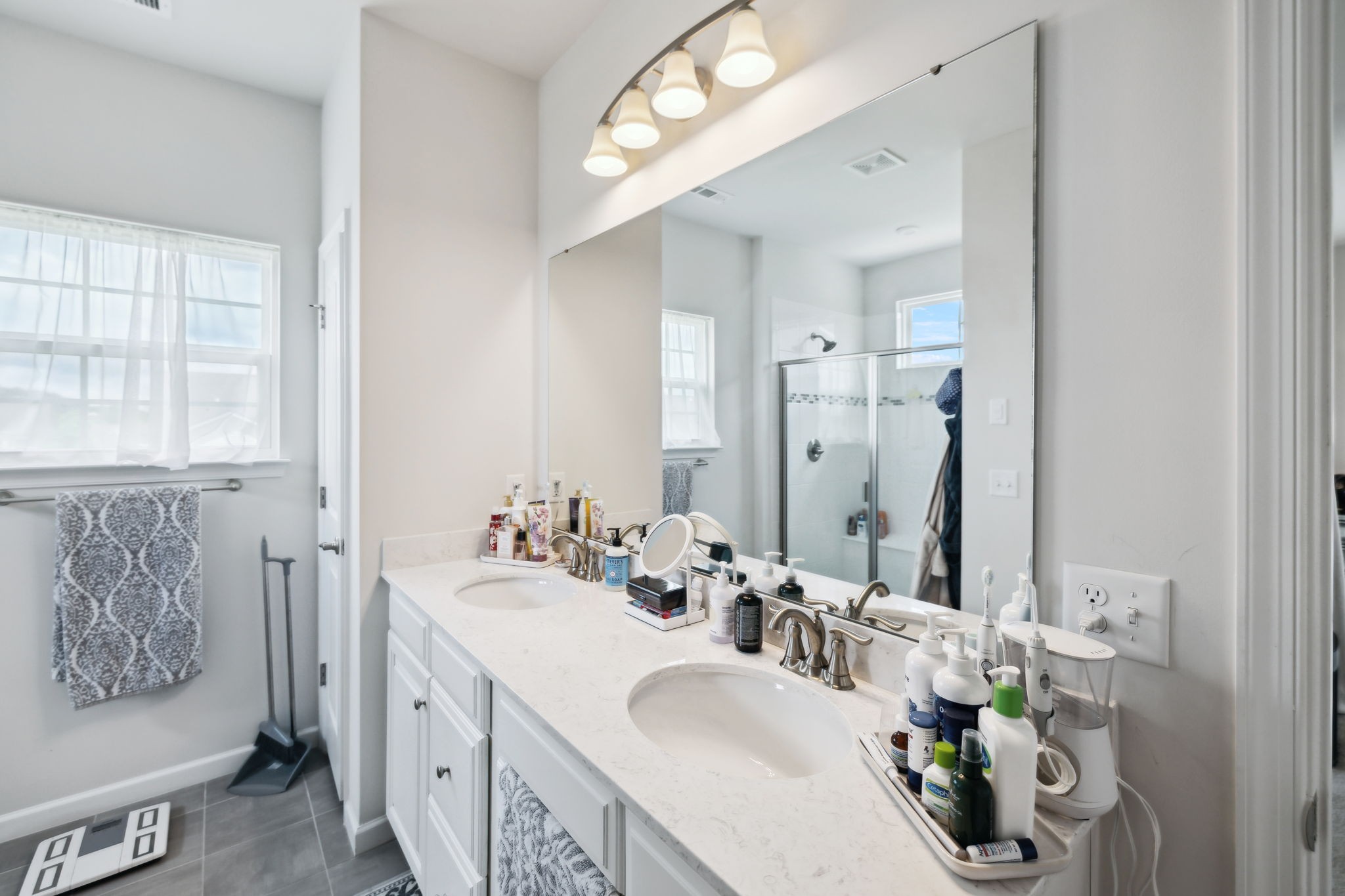 2030 Oglethorpe Drive Franklin, TN 37064 - Photo 45 of 54 a bathroom with double vanity sinks a toilet and a mirror