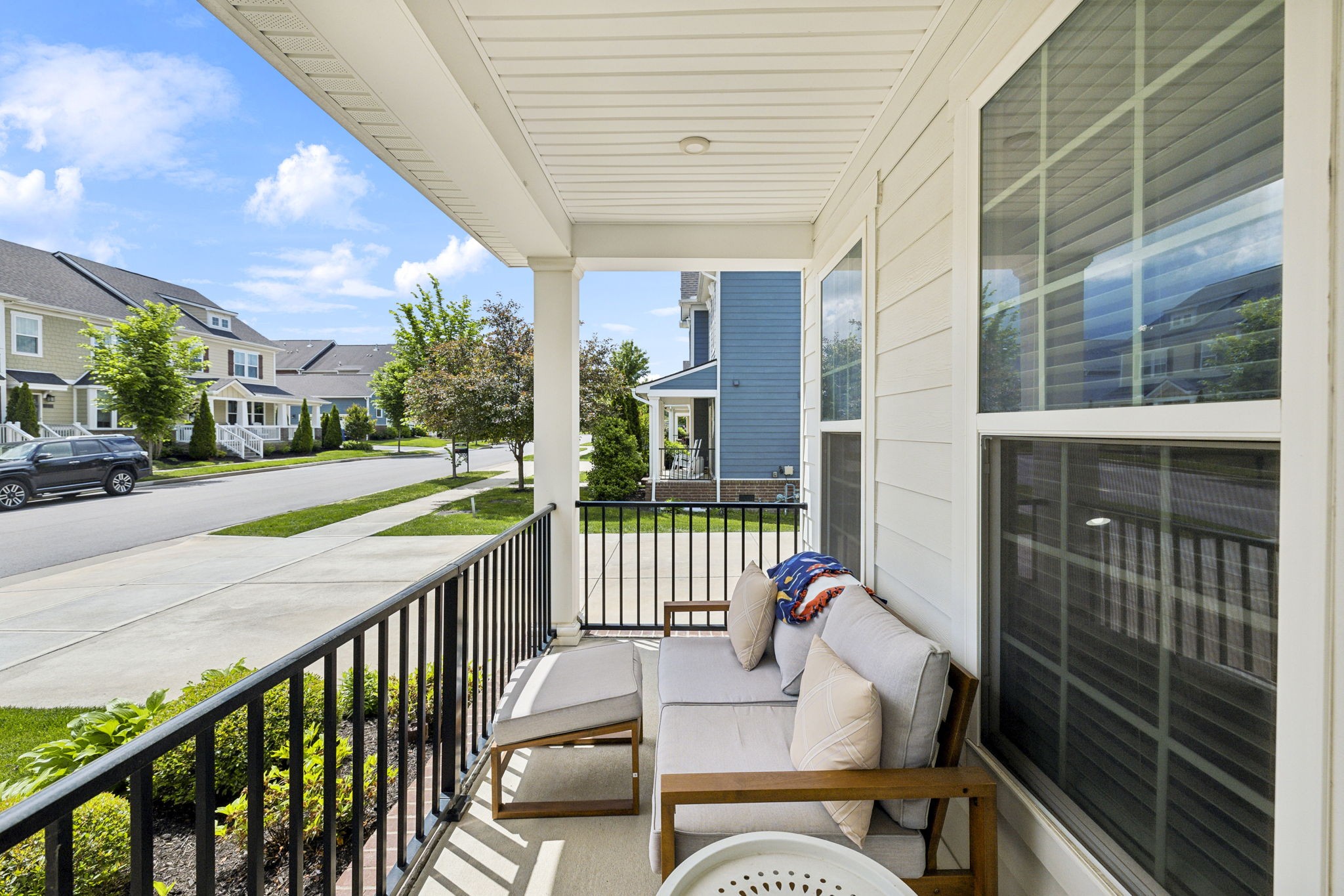 2030 Oglethorpe Drive Franklin, TN 37064 - Photo 5 of 54 a view of an chair and tables in the balcony