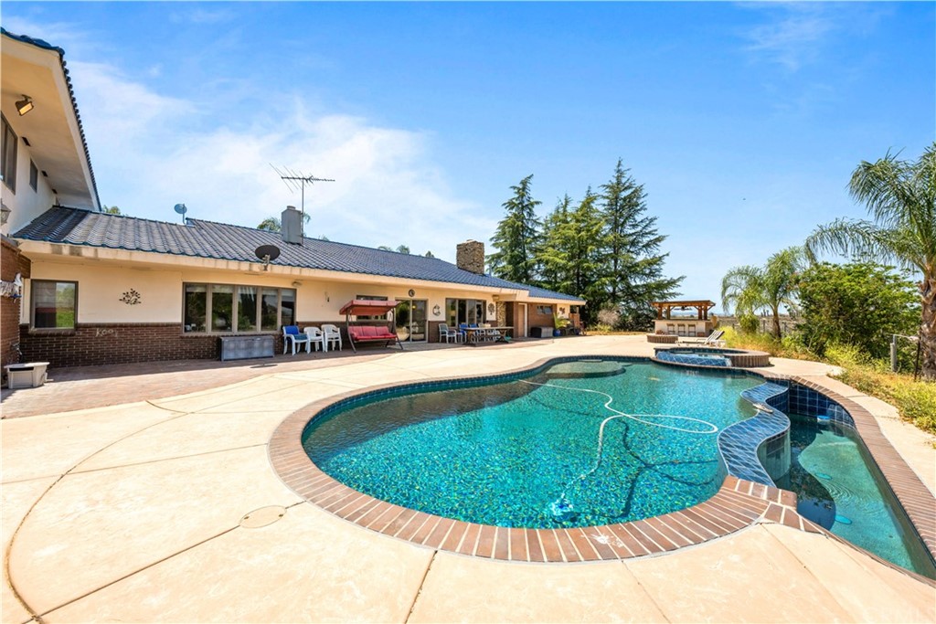 34970 Santa Rita Road Temecula, CA 92592 - Photo 17 of 38 a view of a swimming pool with a patio