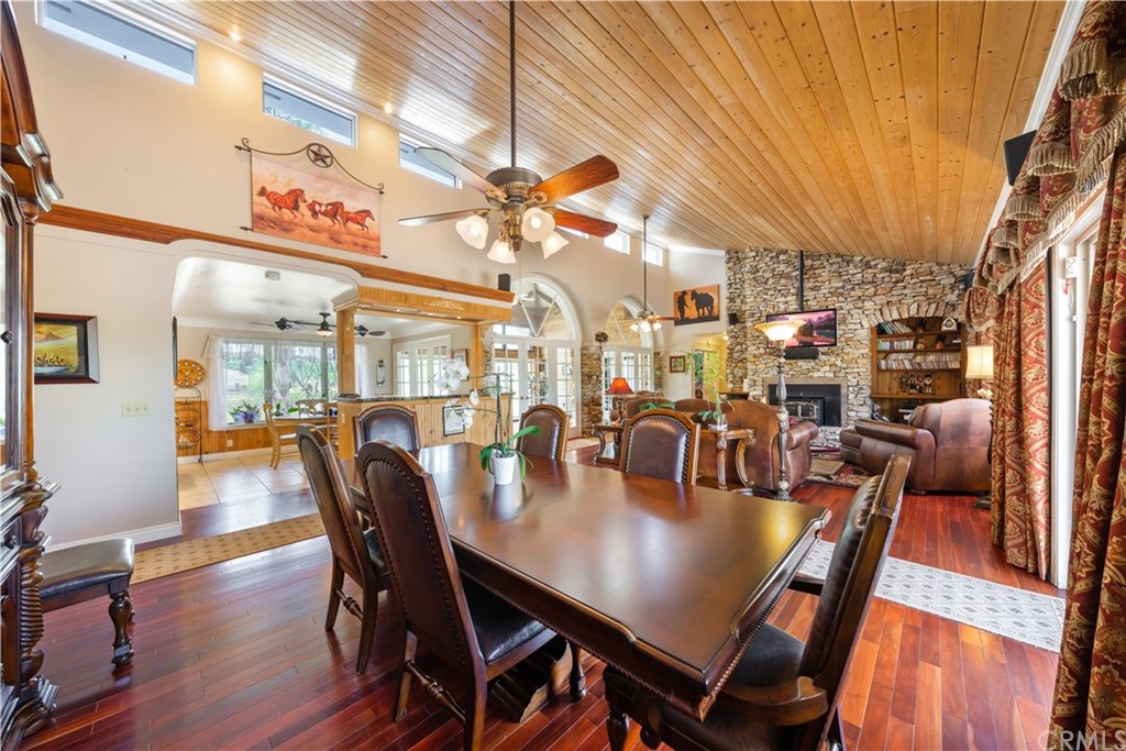 34970 Santa Rita Road Temecula, CA 92592 - Photo 24 of 38 a view of a dining room with furniture and wooden floor