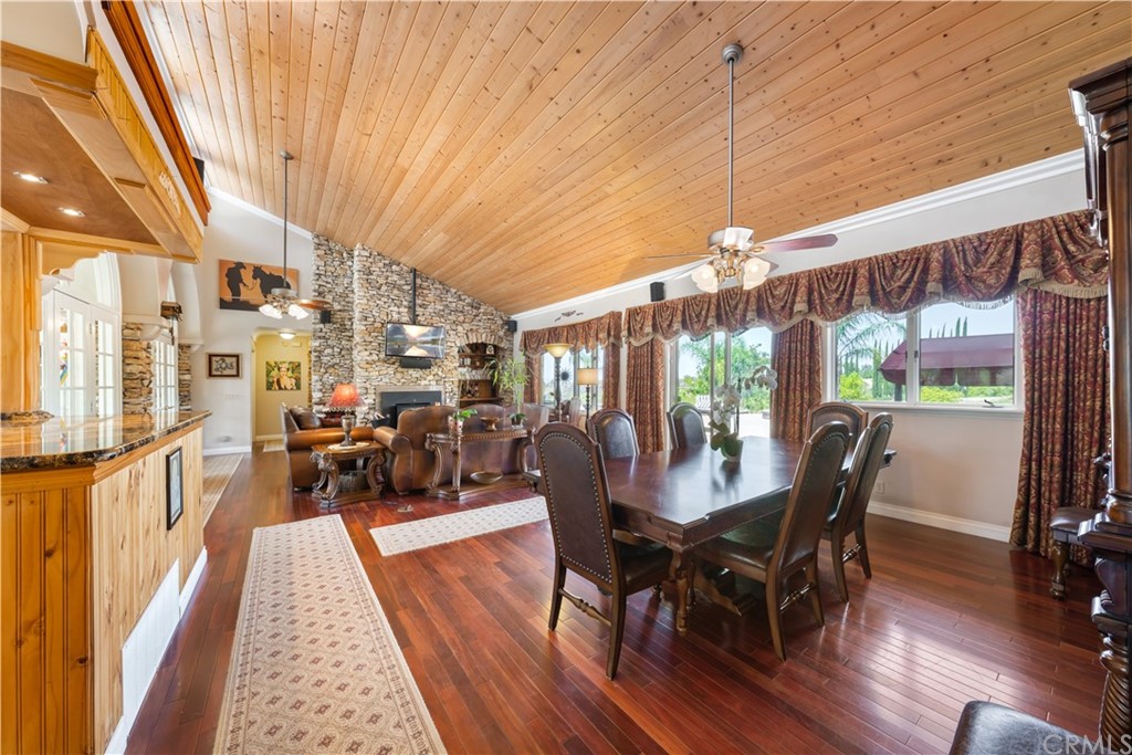 34970 Santa Rita Road Temecula, CA 92592 - Photo 25 of 38 a view of a dining room with furniture window and wooden floor