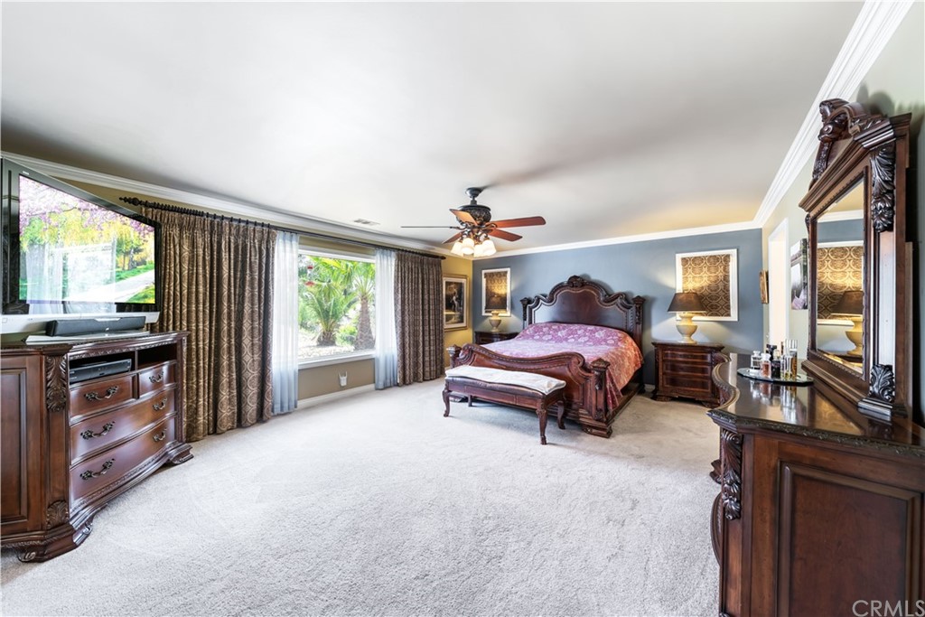 34970 Santa Rita Road Temecula, CA 92592 - Photo 29 of 38 a outdoor living room with furniture and a flat screen tv
