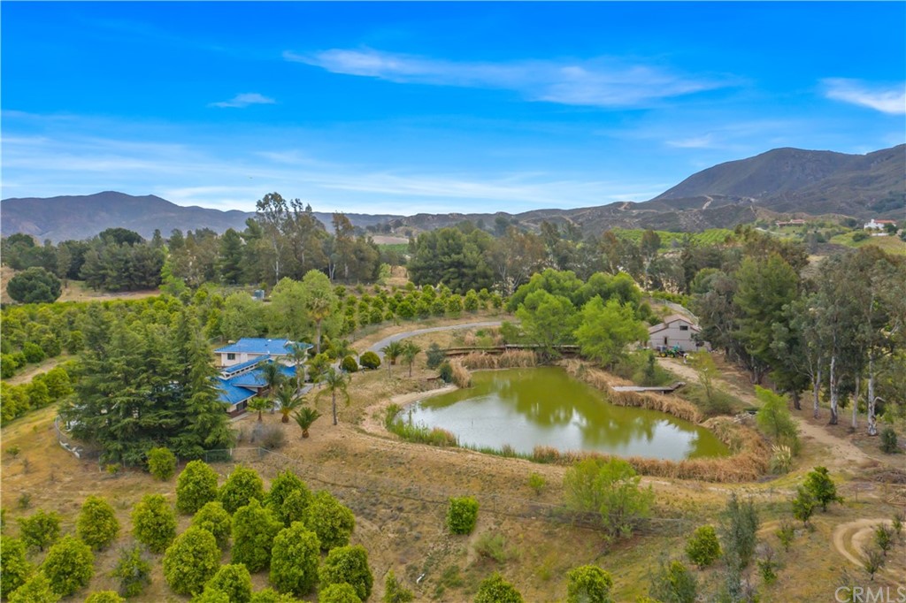 34970 Santa Rita Road Temecula, CA 92592 - Photo 9 of 38 a view of a lake with mountains in the background