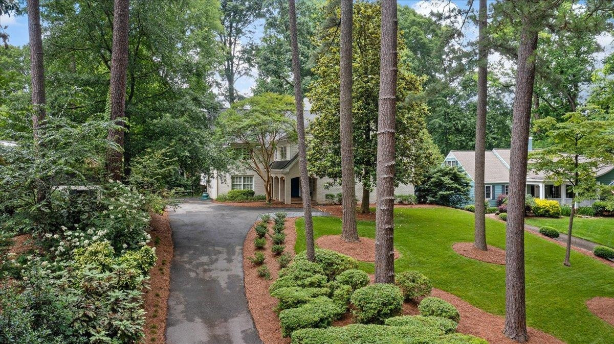 208 Walden Place Raleigh, NC 27609 - Photo 1 of 4 a view of a park with large trees