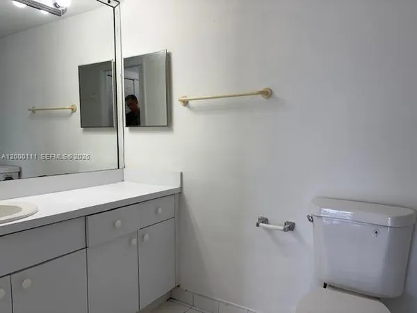 a bathroom with a sink and mirror