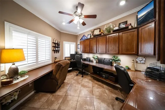 a kitchen with granite countertop a stove a sink and a refrigerator