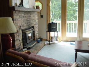 528 Painted Ridge Lane Mars Hill, NC 28754 - Photo 4 of 5 a living room with furniture and a fireplace
