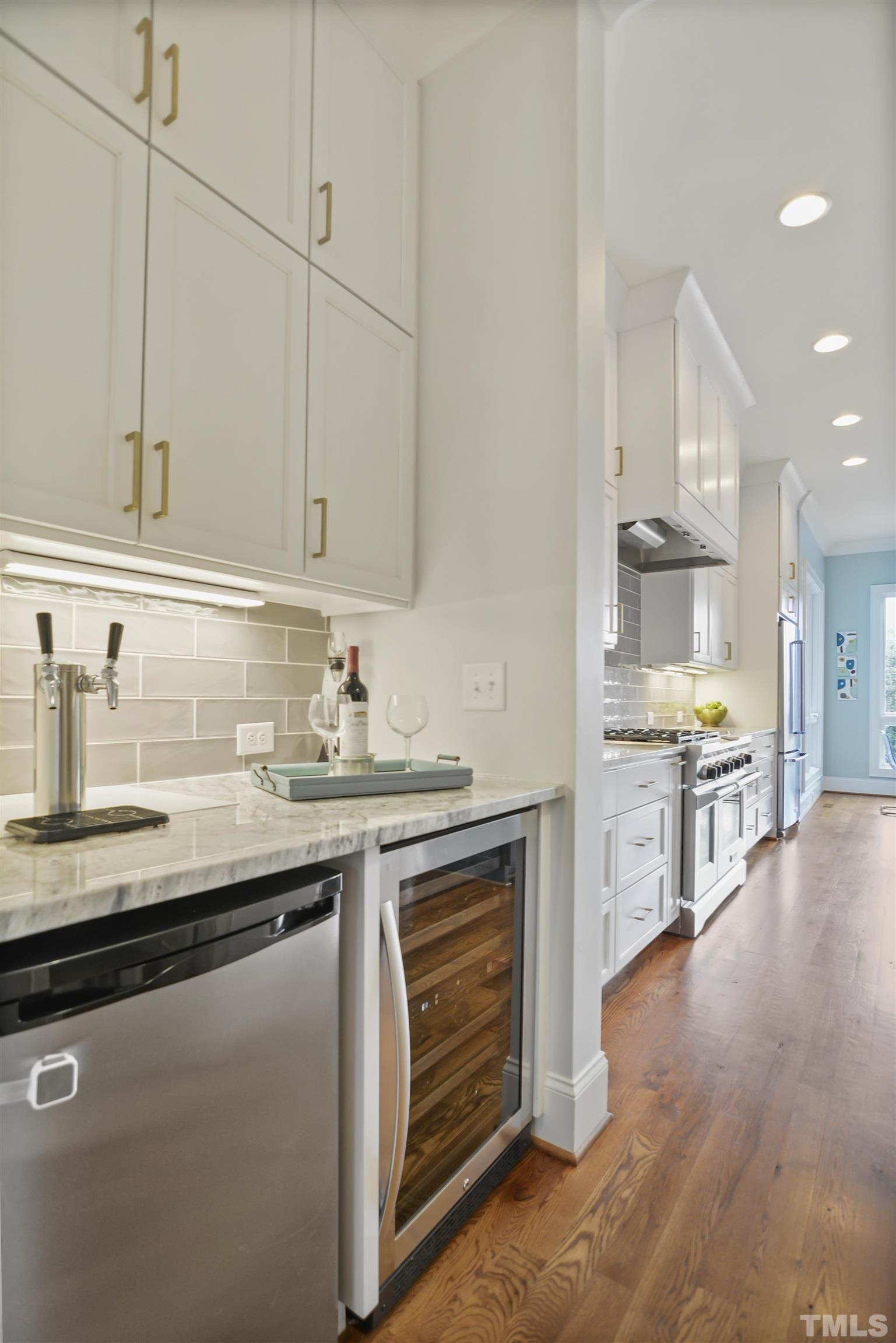1012 Canterbury Road Raleigh, NC 27607 - Photo 14 of 51 a kitchen with stainless steel appliances granite countertop a sink stove and refrigerator