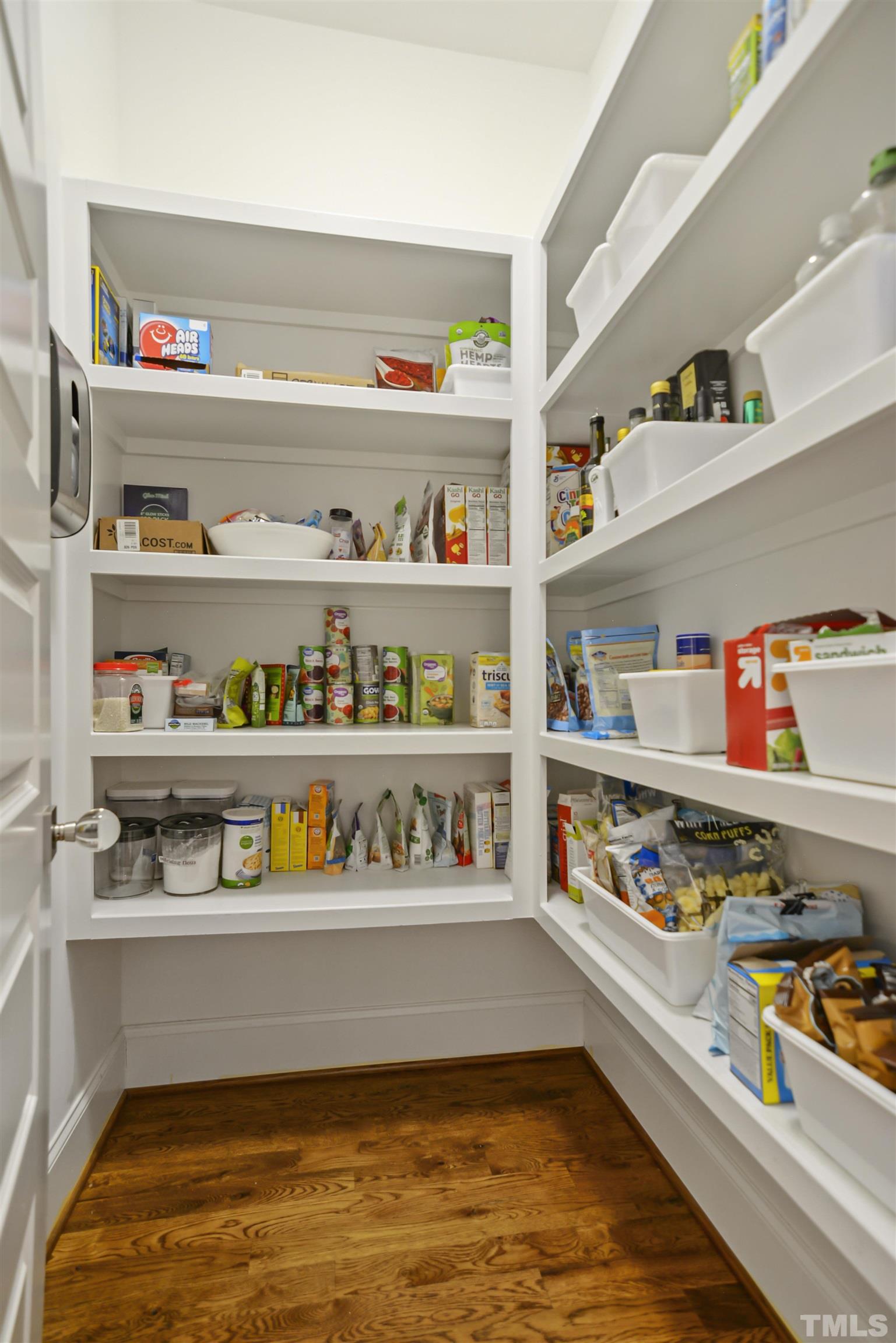 1012 Canterbury Road Raleigh, NC 27607 - Photo 15 of 51 a cabinet with granite countertop lots of different kinds of food