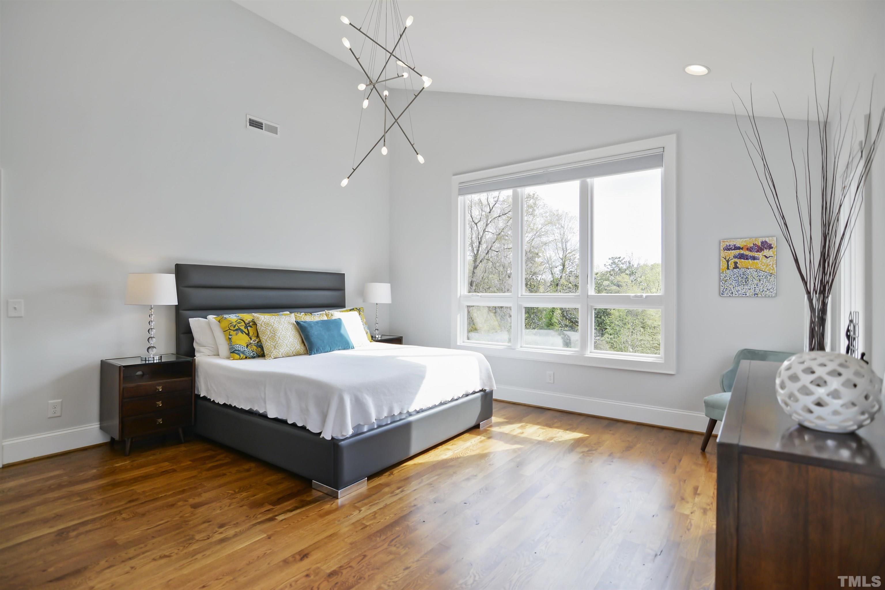 1012 Canterbury Road Raleigh, NC 27607 - Photo 17 of 51 a bedroom with a bed and a window