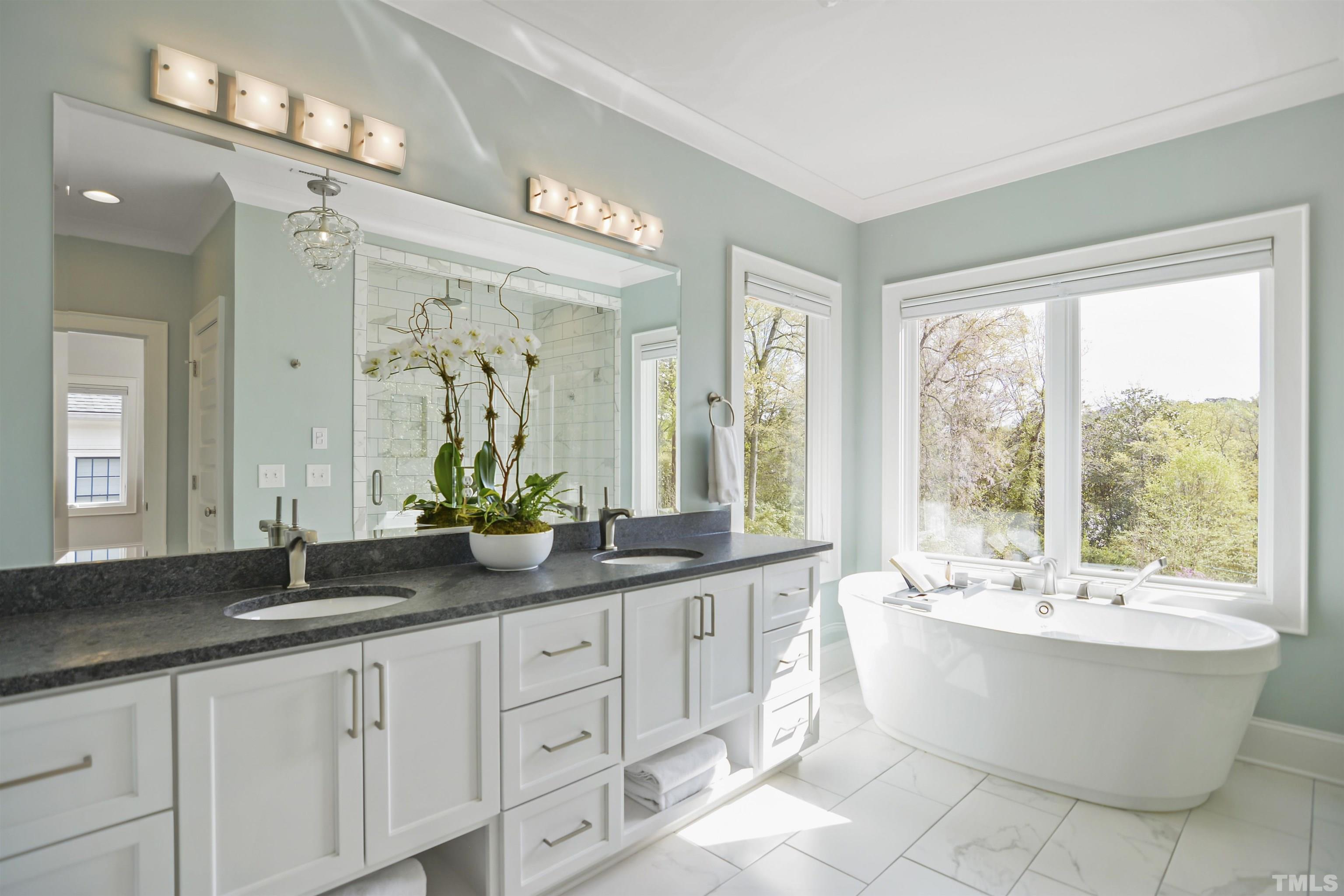 1012 Canterbury Road Raleigh, NC 27607 - Photo 19 of 51 a bathroom with a large tub sink and double vanity
