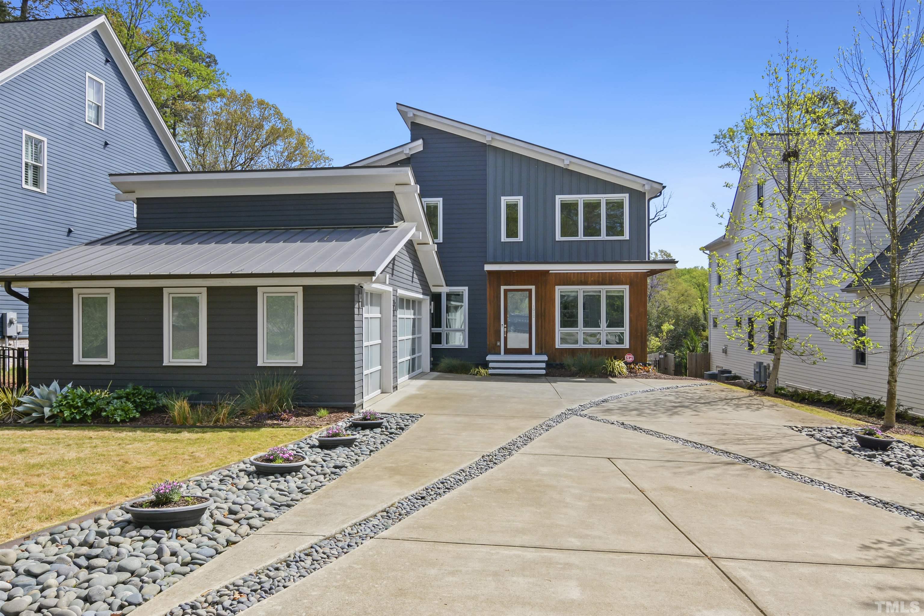 1012 Canterbury Road Raleigh, NC 27607 - Photo 2 of 51 a front view of a house with garden