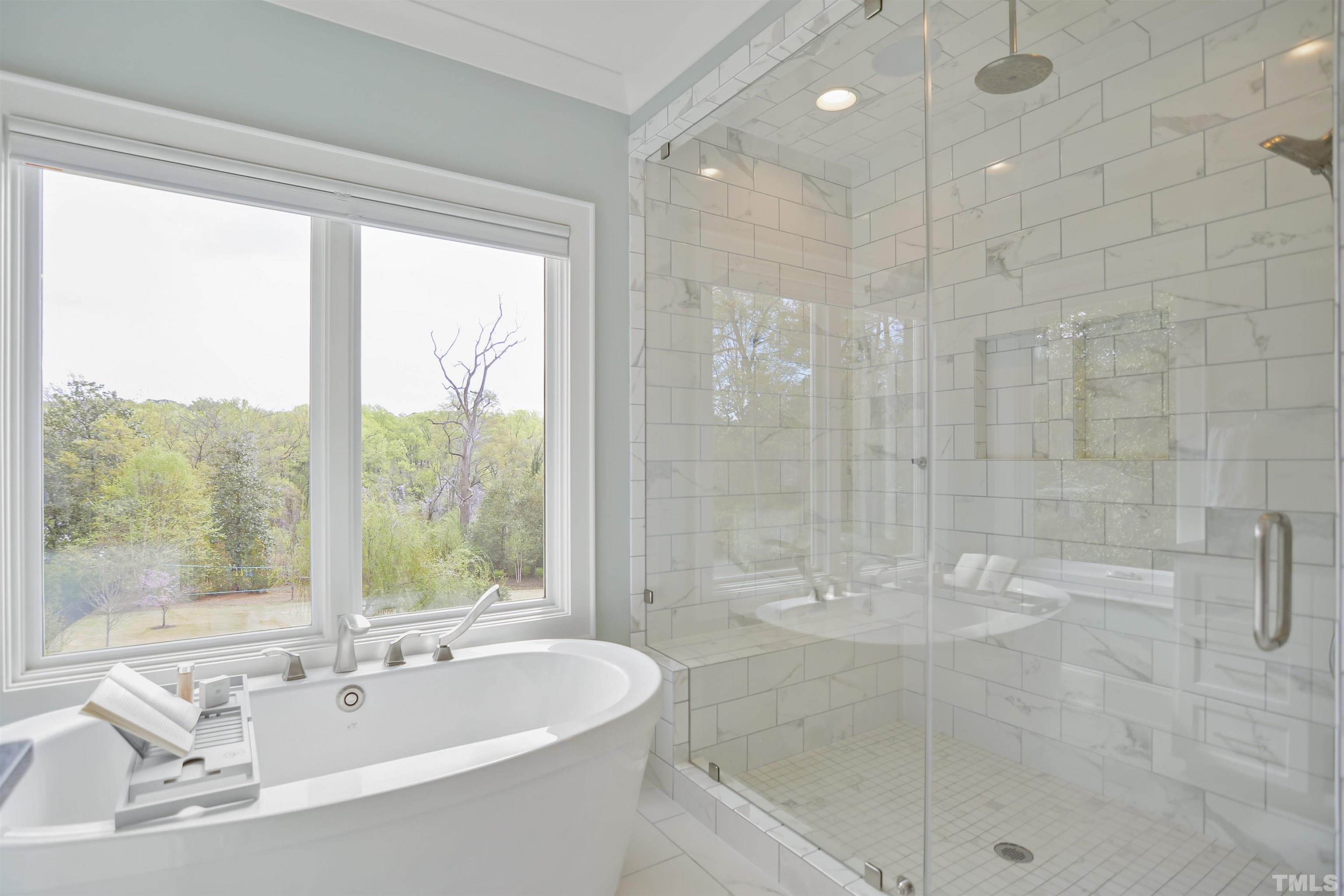 1012 Canterbury Road Raleigh, NC 27607 - Photo 21 of 51 a bathroom with a bathtub and a shower