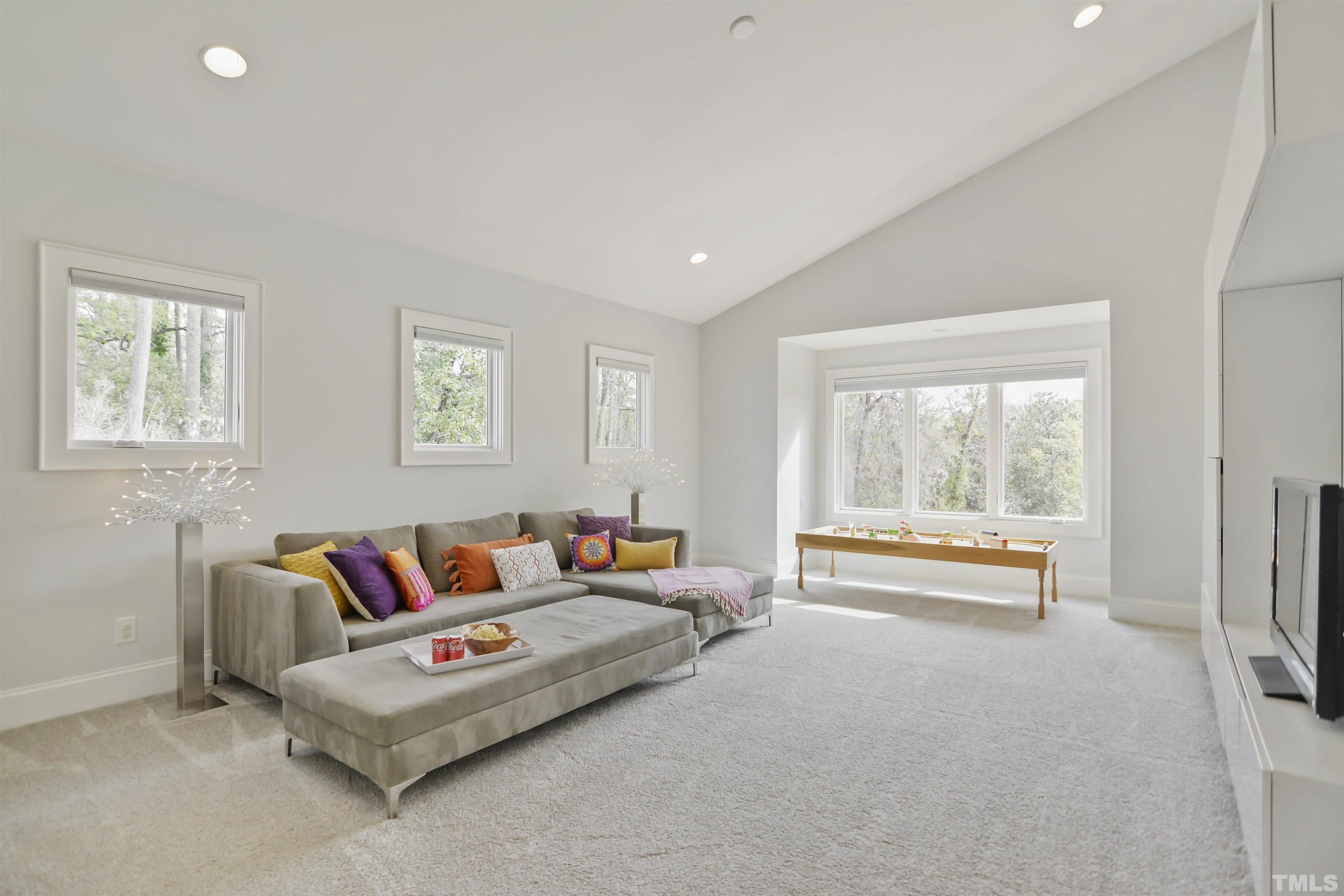 1012 Canterbury Road Raleigh, NC 27607 - Photo 30 of 51 a living room with furniture and a large window
