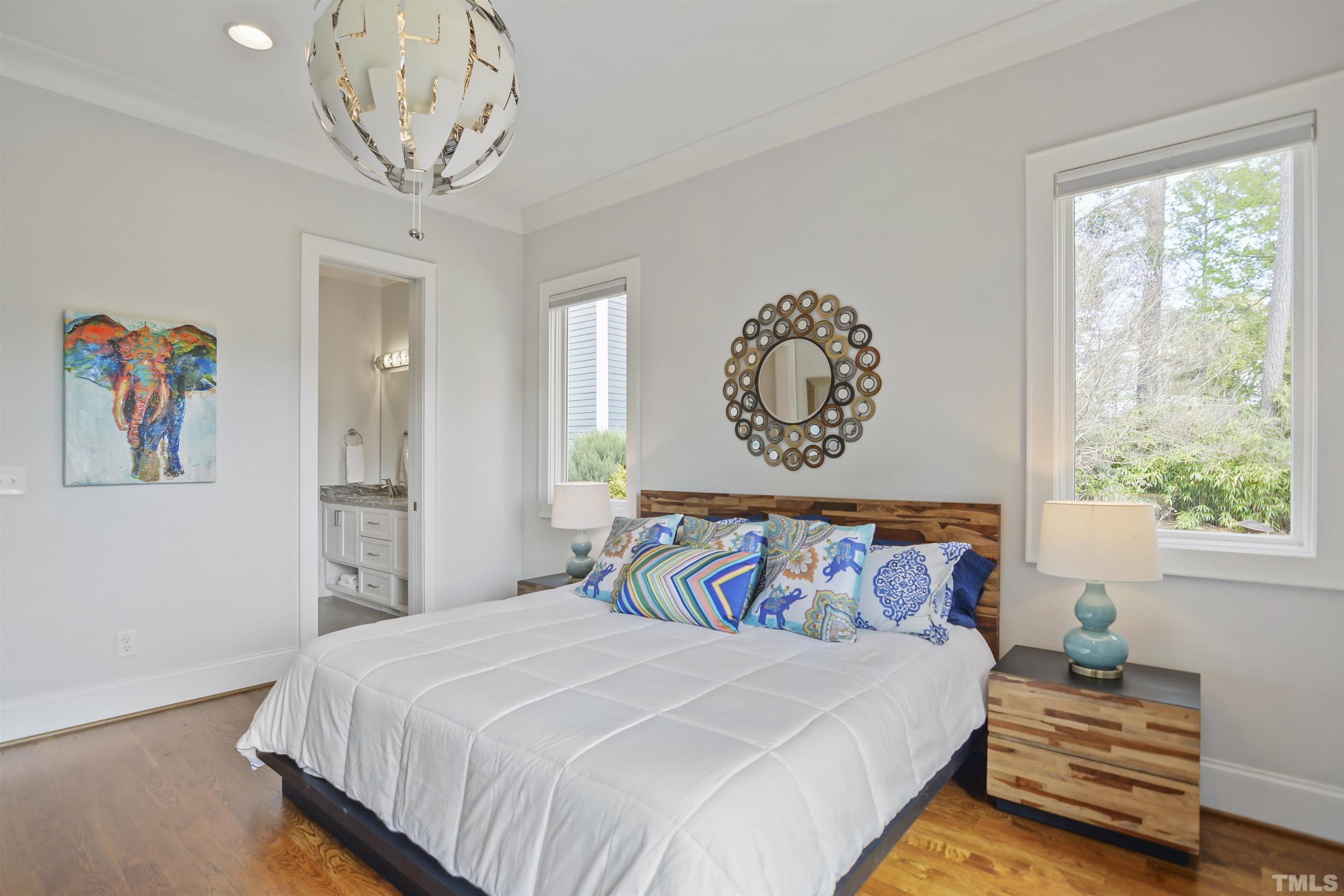 1012 Canterbury Road Raleigh, NC 27607 - Photo 34 of 51 a bedroom with a bed and a window