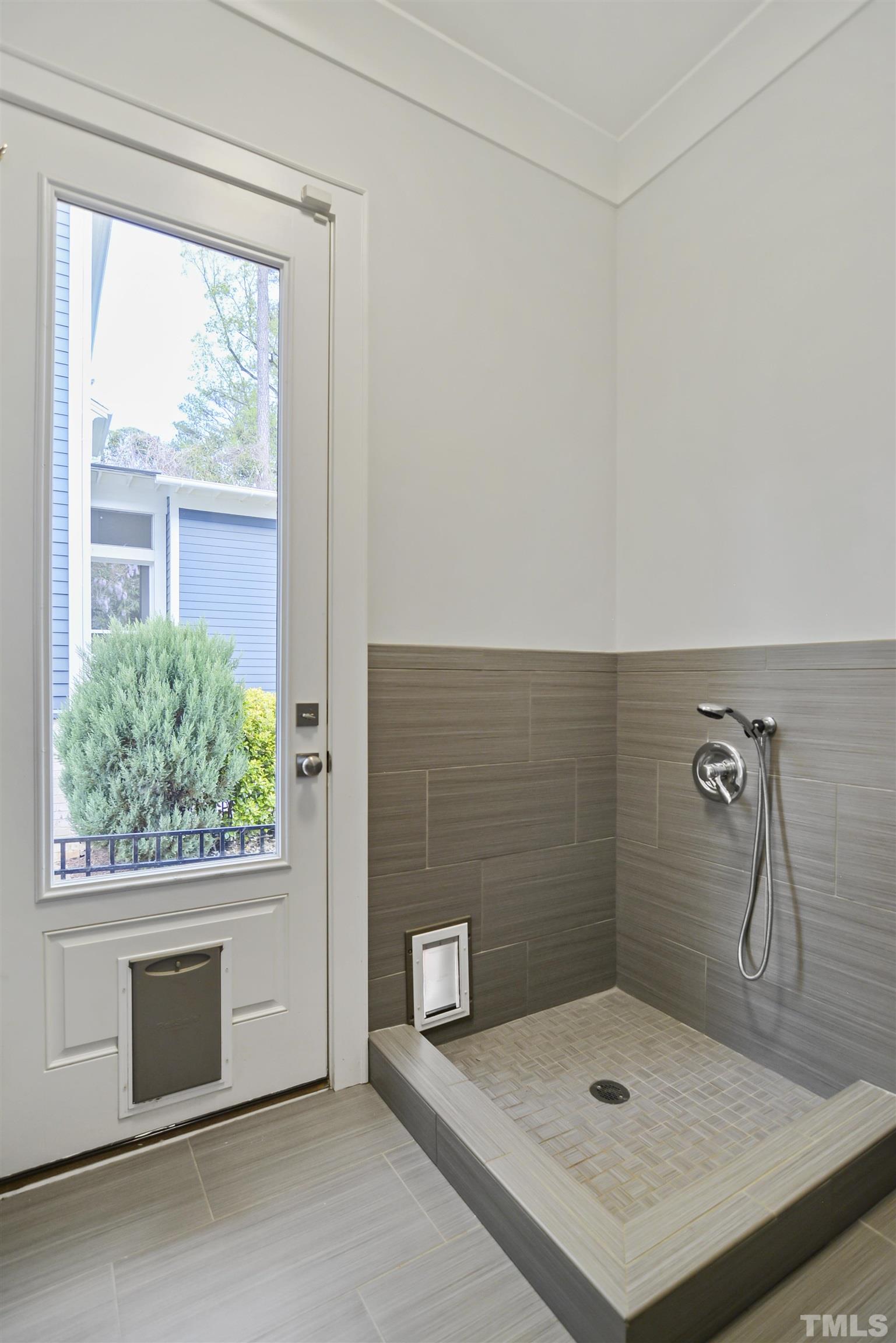 1012 Canterbury Road Raleigh, NC 27607 - Photo 37 of 51 a bathroom with a shower sink and mirror