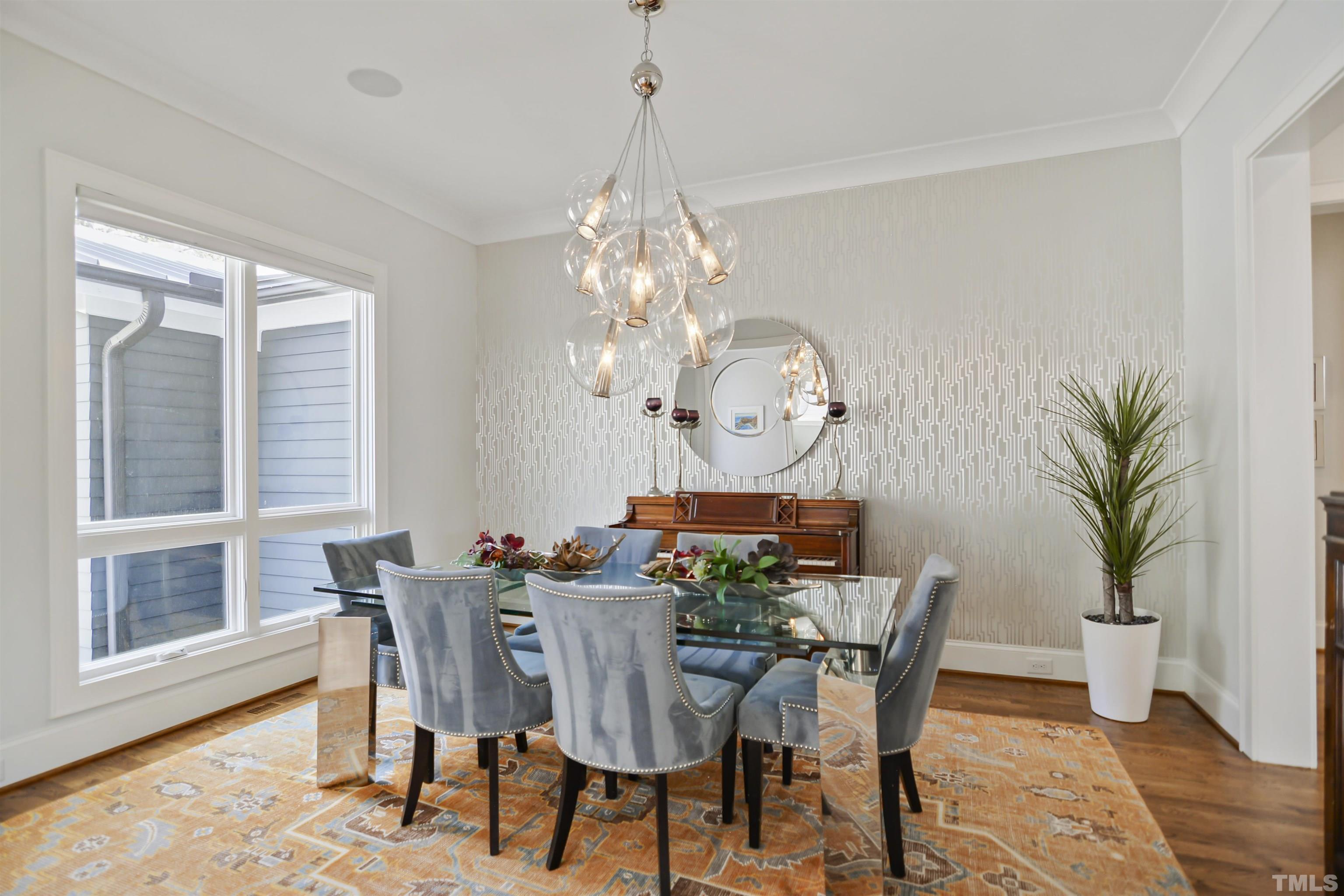 1012 Canterbury Road Raleigh, NC 27607 - Photo 4 of 51 a view of a dining room with furniture window and wooden floor