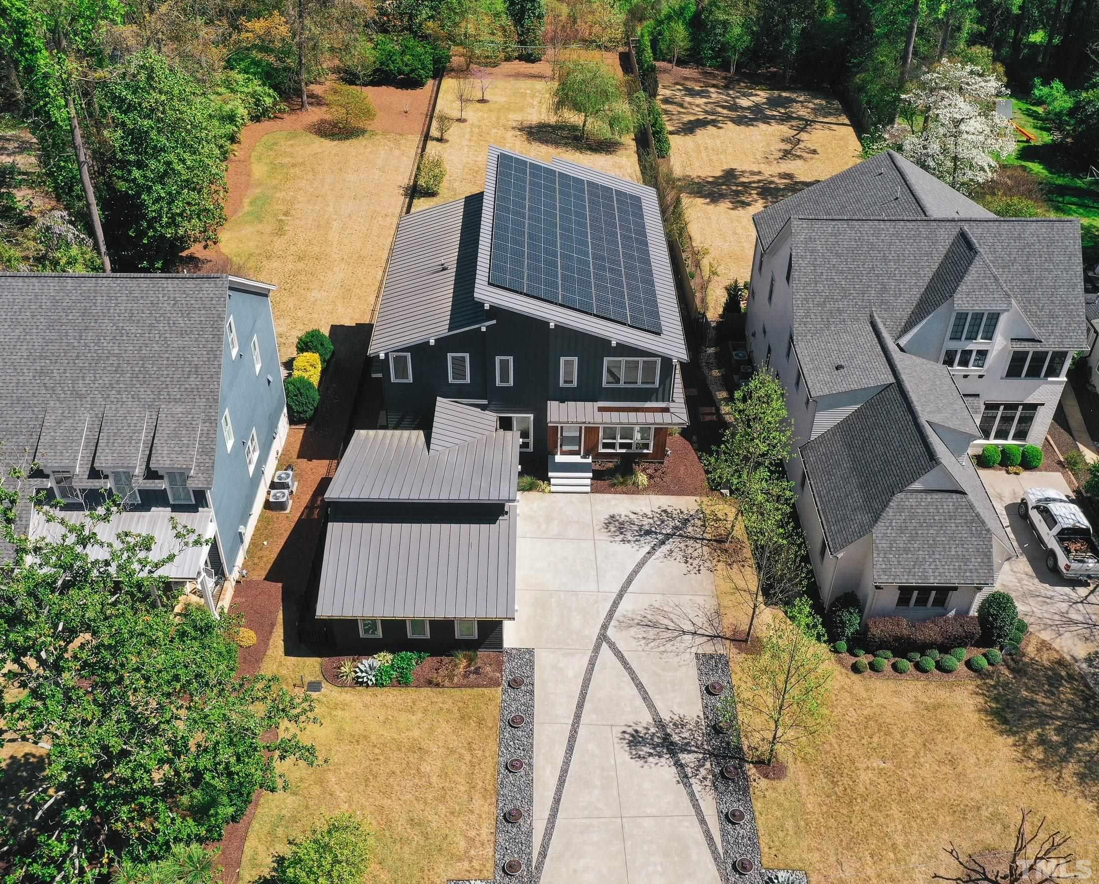 1012 Canterbury Road Raleigh, NC 27607 - Photo 46 of 51 an aerial view of a house with a yard and mountain view in back