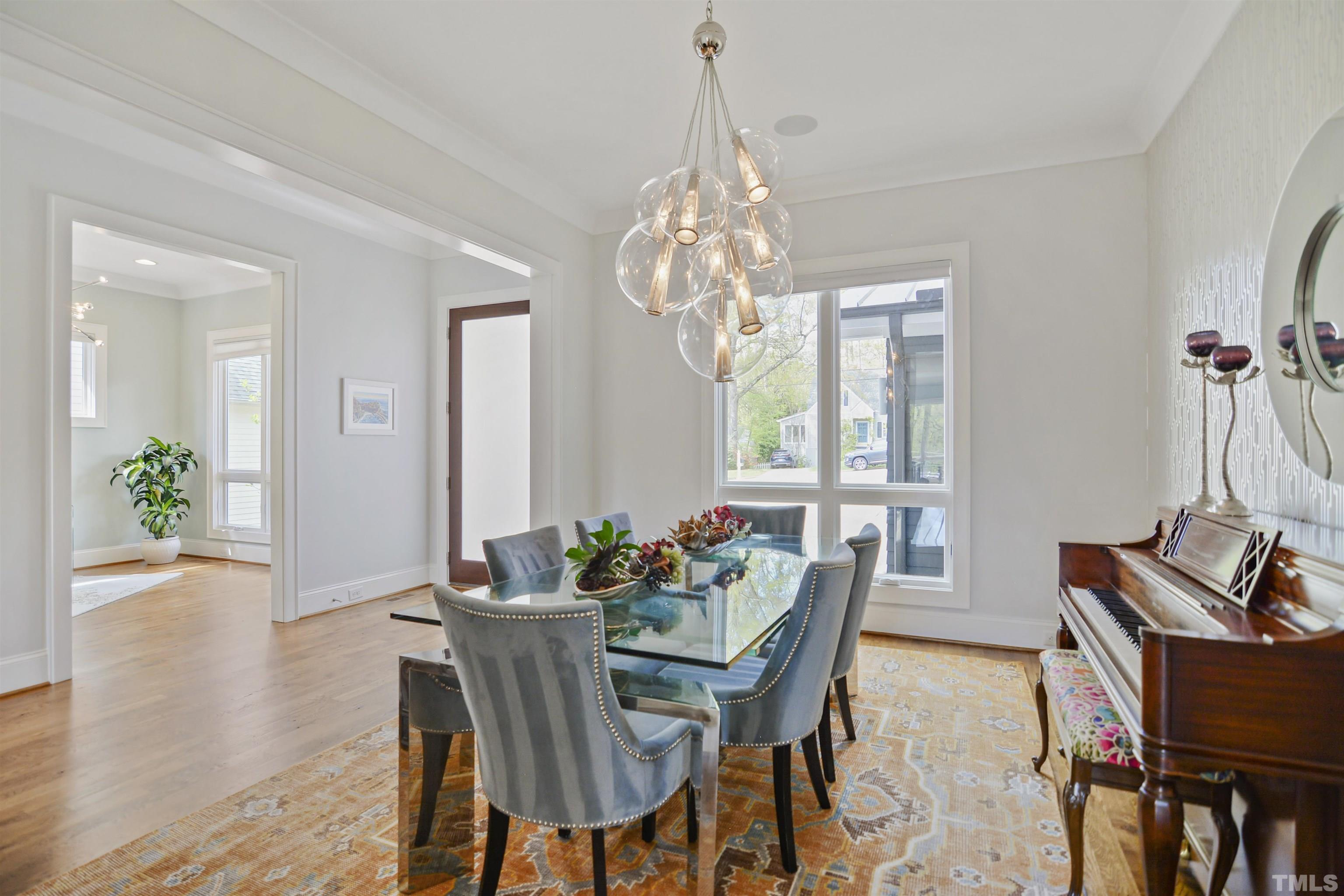 1012 Canterbury Road Raleigh, NC 27607 - Photo 5 of 51 a view of a dining room with furniture window and wooden floor