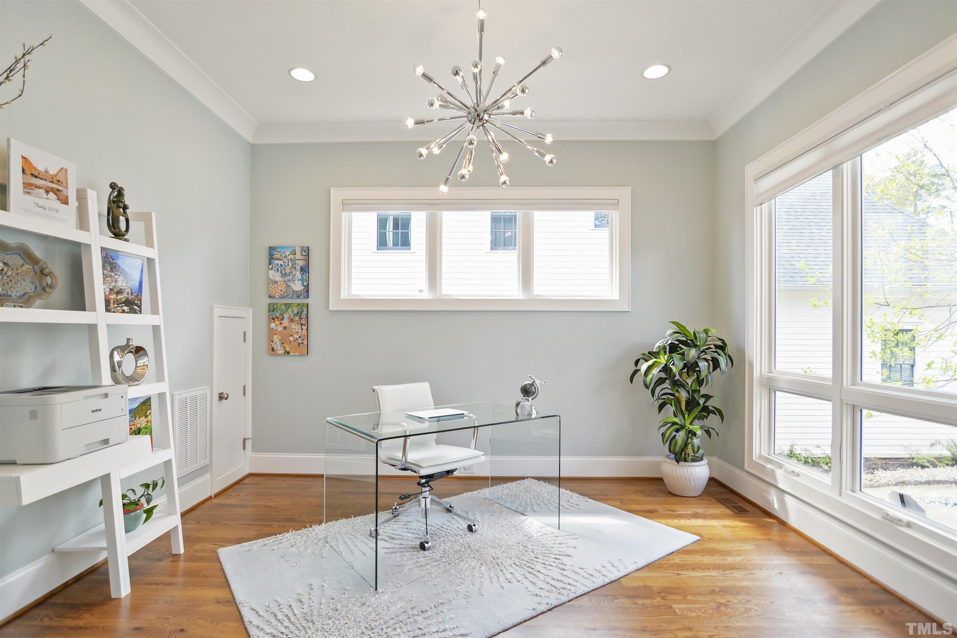 1012 Canterbury Road Raleigh, NC 27607 - Photo 6 of 51 a living room with furniture and a large window