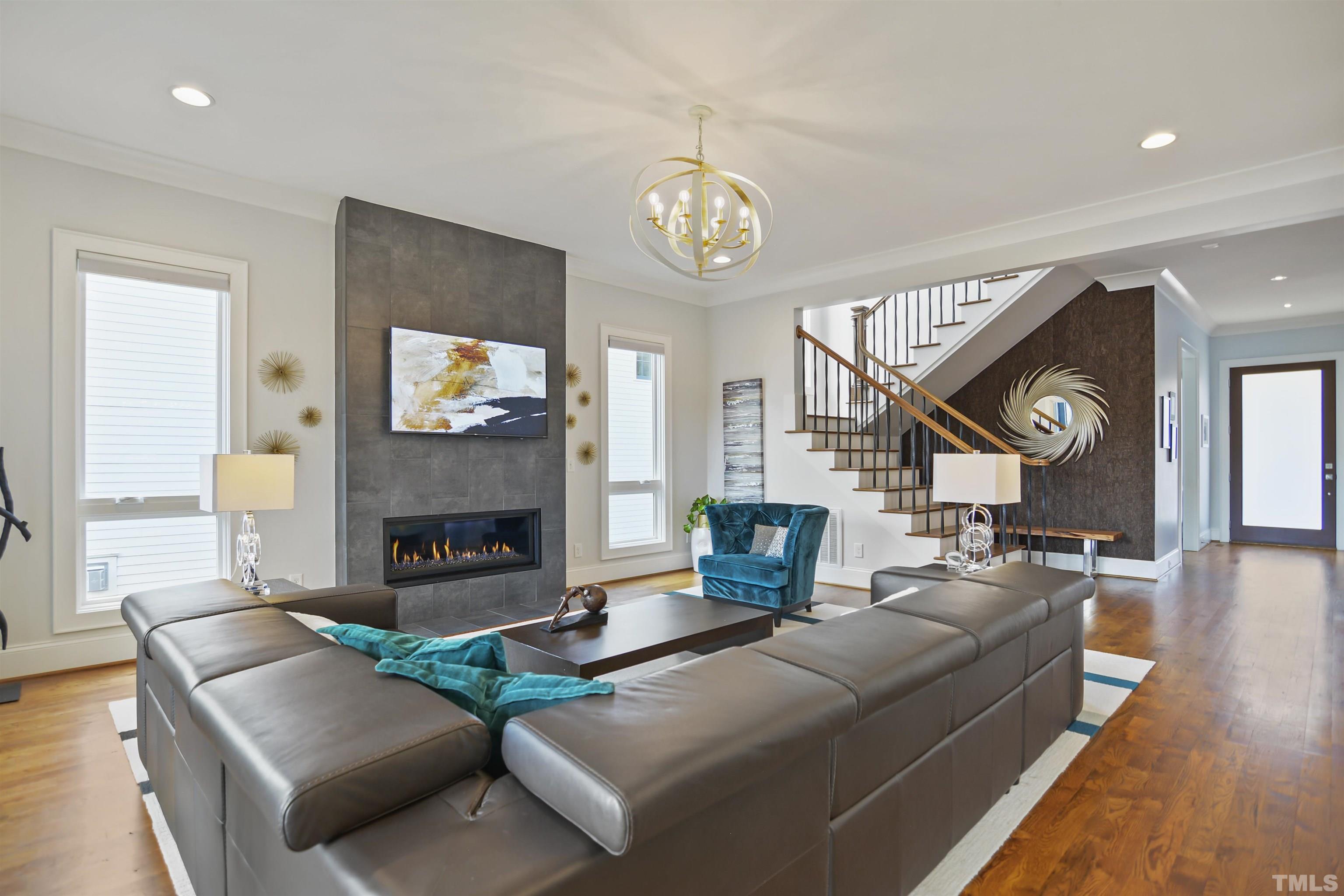 1012 Canterbury Road Raleigh, NC 27607 - Photo 9 of 51 a living room with fireplace furniture and a fireplace