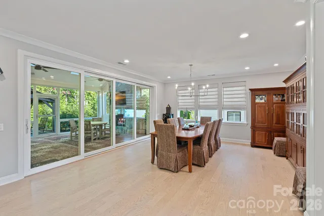 a large kitchen with a table and chairs