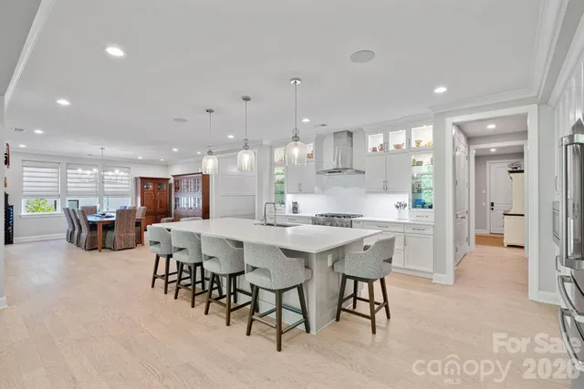 a view of a kitchen with wooden cabinets and white appliances