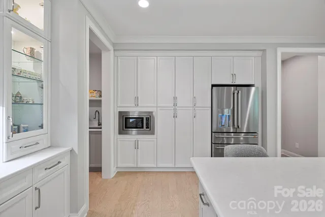 a kitchen with a sink and a fireplace