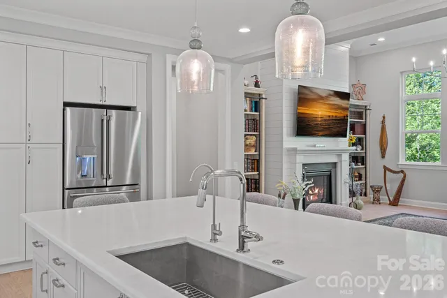 a kitchen with a sink stove and refrigerator