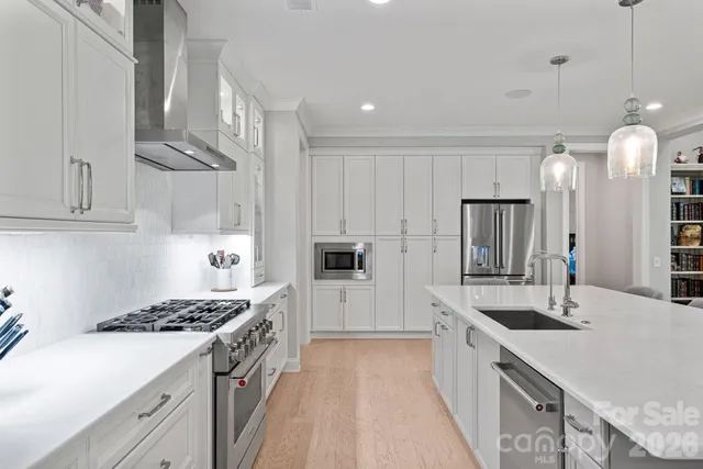 a kitchen with sink and cabinets