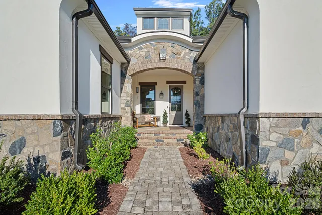 a front view of house with yard and green space