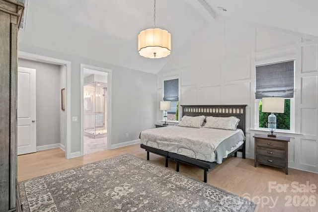 a bathroom with a tub shower vanity and a sink
