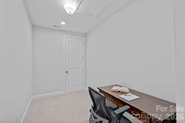 a view of a chairs and table in the backyard