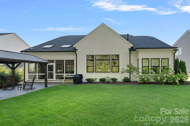 a view of yard with patio