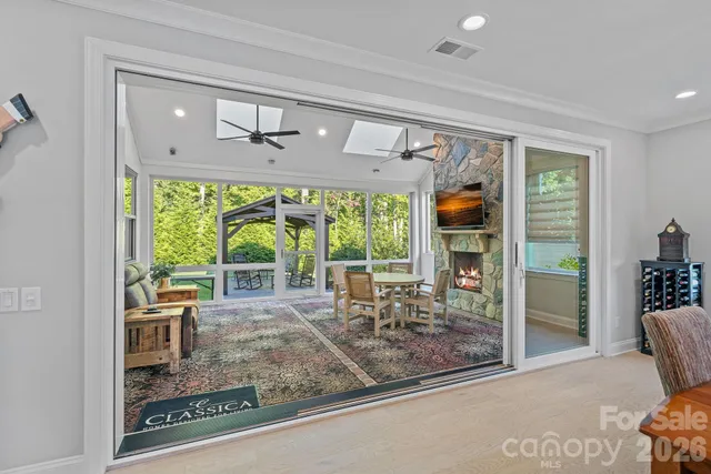 a large kitchen with a table and chairs