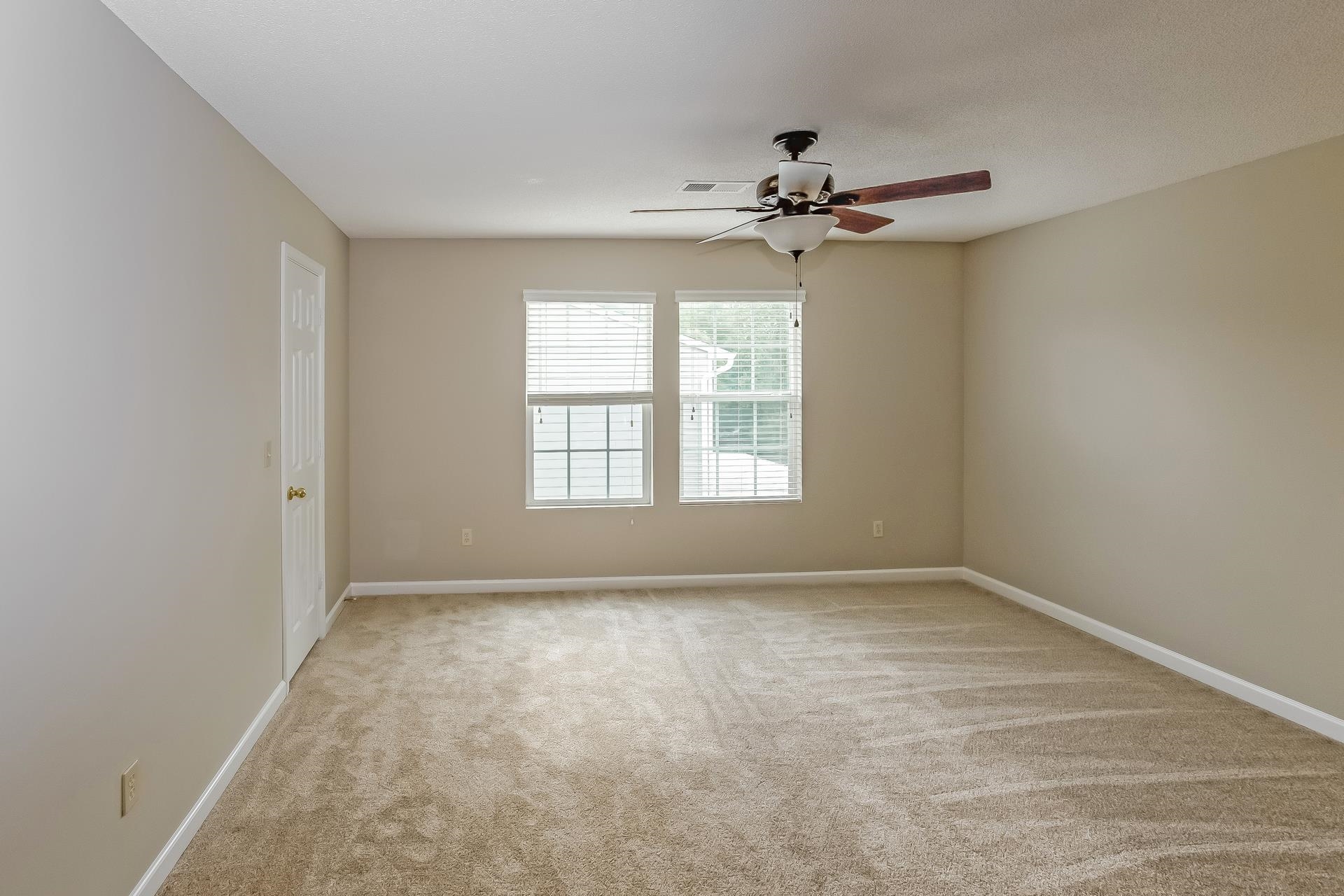 9966 Chariden Drive Cordova, TN 38016 - Photo 11 of 17 an empty room with windows and fan