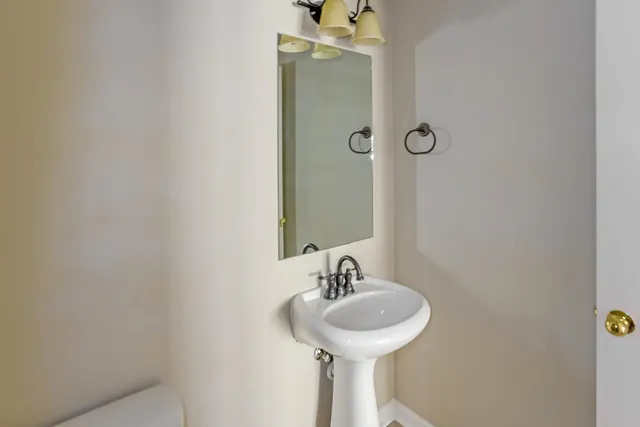 a bathroom with a sink and mirror