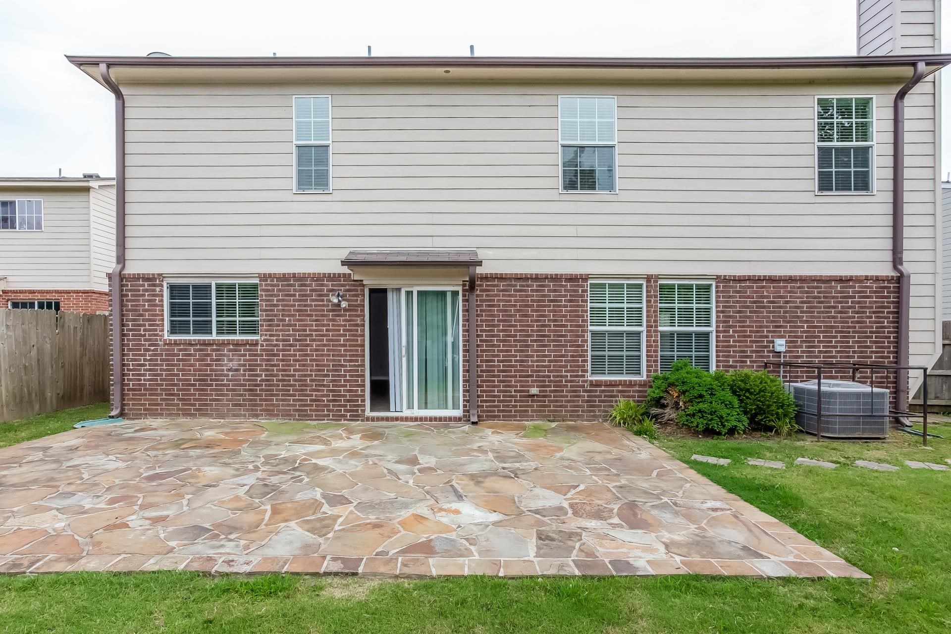 9966 Chariden Drive Cordova, TN 38016 - Photo 15 of 17 a front view of a house with a yard and garage